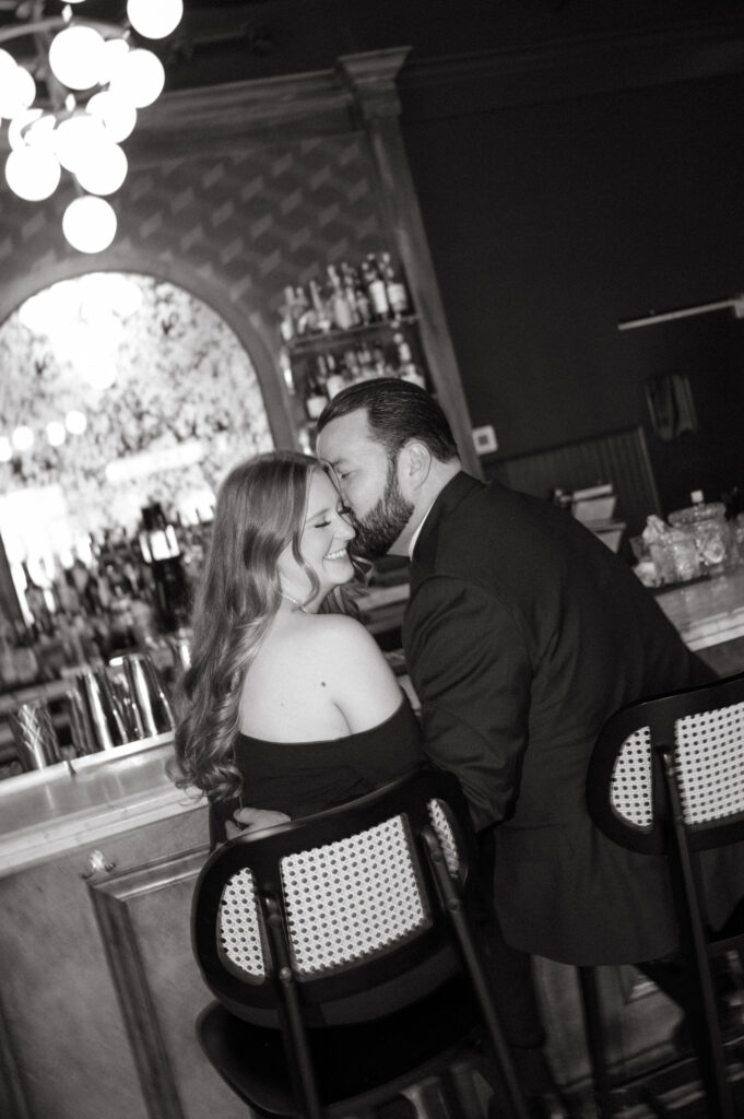 black and white candid engagement photo
