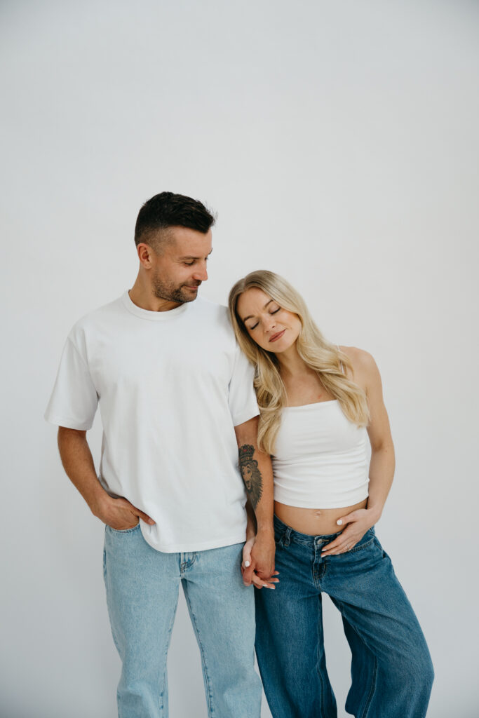 Photo of a couple expecting first baby in a studio in New York